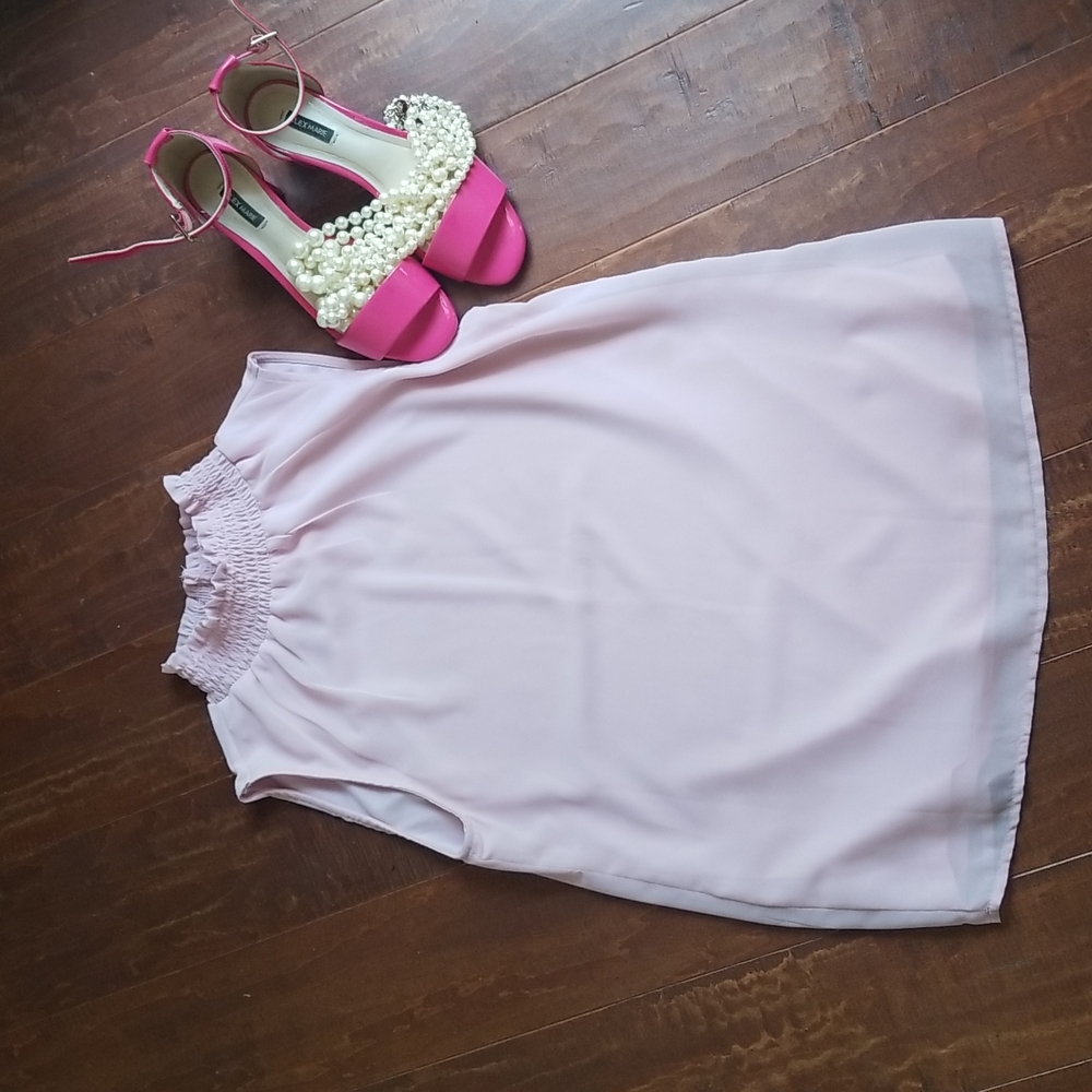 Sleeveless pale pink turtleneck shell